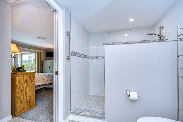 bathroom with tiled shower