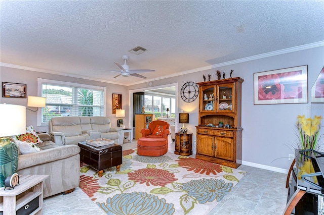 living room featuring a textured ceiling, ceiling fan, and ornamental molding