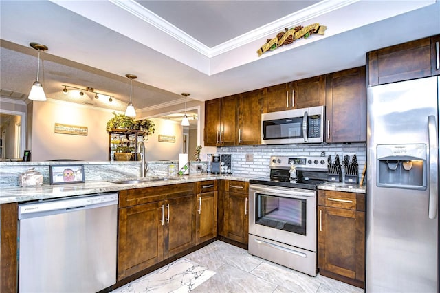 kitchen with stainless steel appliances, sink, backsplash, hanging light fixtures, and light stone countertops