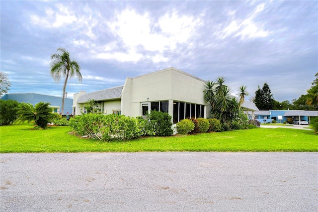 view of side of home featuring a yard