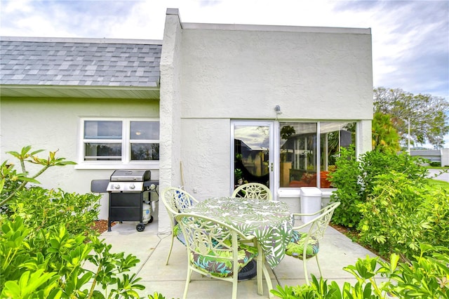 rear view of property featuring a patio