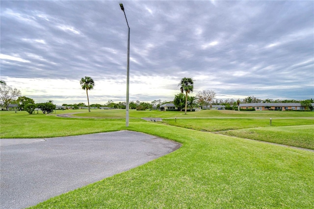 view of property's community with a lawn