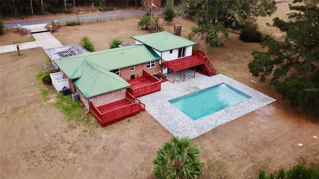 view of swimming pool with a deck and a patio area