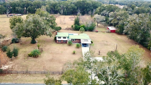 birds eye view of property with a rural view