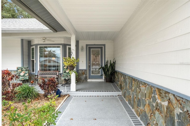 entrance to property with ceiling fan