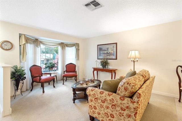 sitting room with light colored carpet