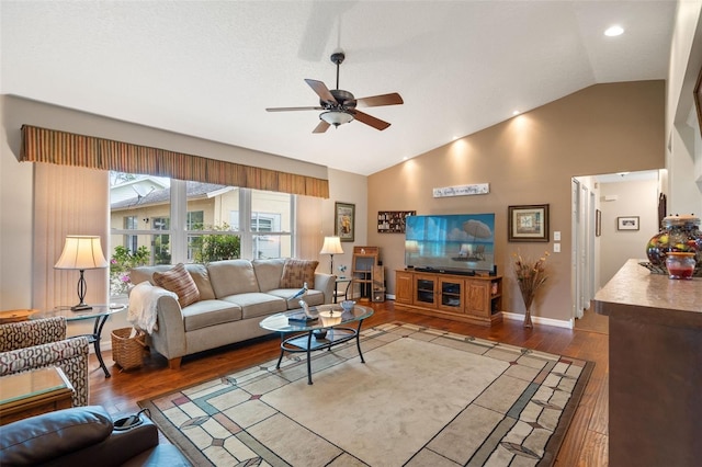 living room with vaulted ceiling, ceiling fan, and hardwood / wood-style floors