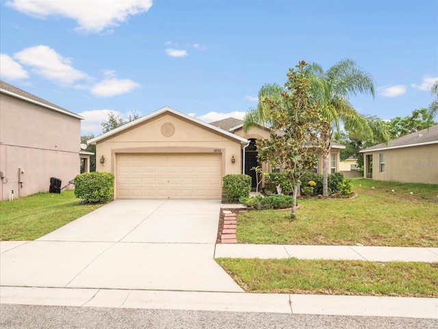 view of front of property with a front lawn and a garage