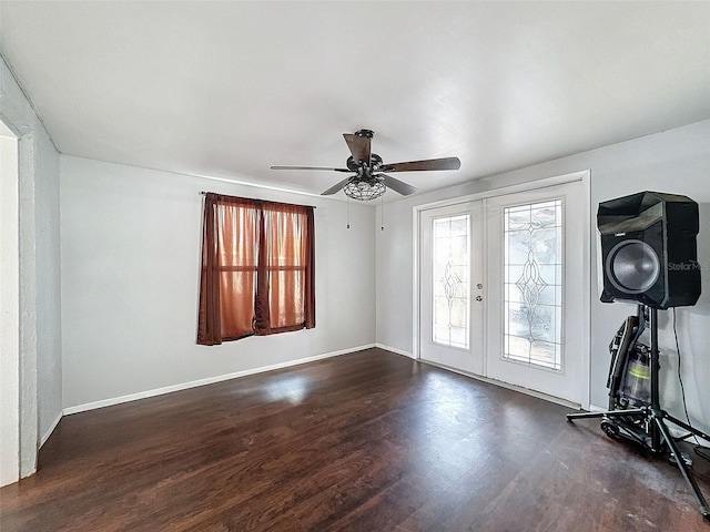 entrance foyer with ceiling fan, dark hardwood / wood-style flooring, and french doors