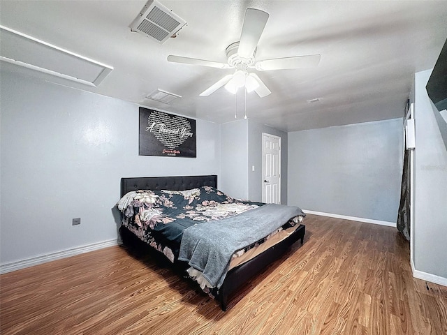 bedroom with ceiling fan and wood-type flooring