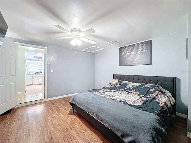 bedroom with light wood-type flooring and ceiling fan