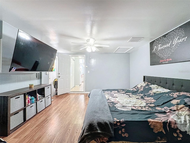 bedroom with ceiling fan and light hardwood / wood-style flooring