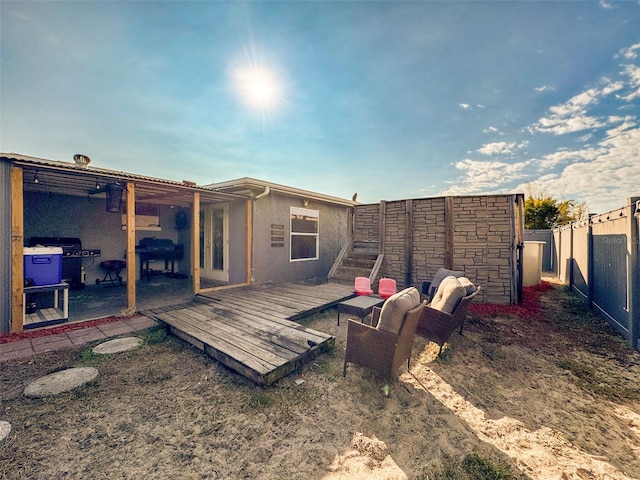 rear view of property featuring a deck