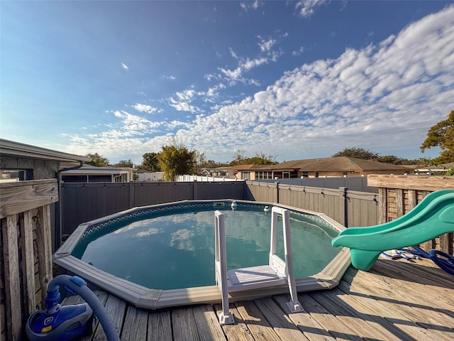 view of swimming pool featuring a deck