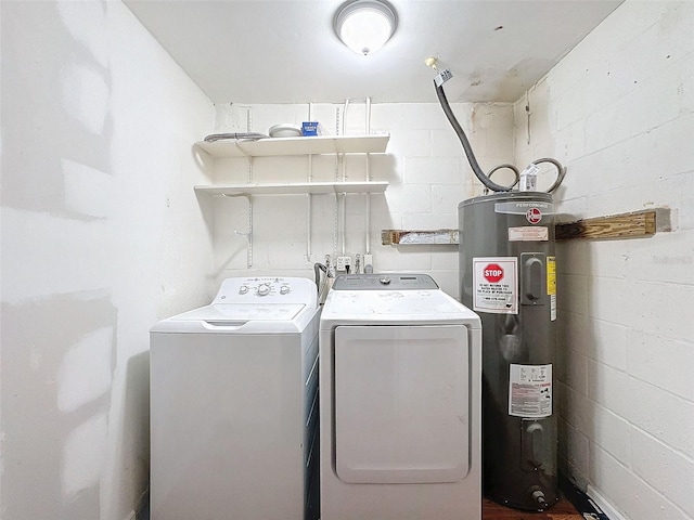 laundry area featuring electric water heater and washer and clothes dryer