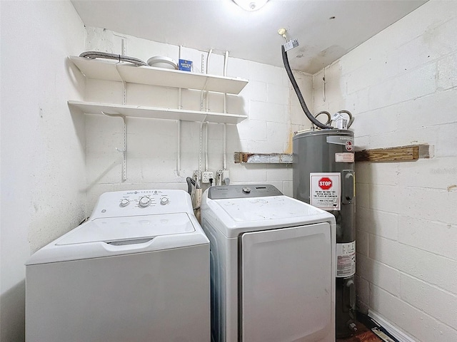 laundry area with washer and clothes dryer and electric water heater