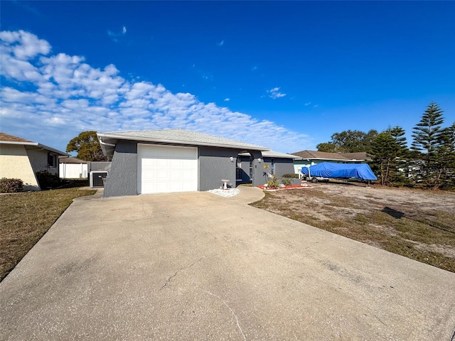 ranch-style home featuring a garage