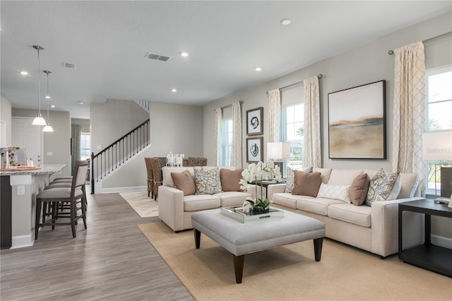 3744 Sky Mountain Aly, Apopka, FL 32712 - living room featuring light hardwood / wood-style floors
