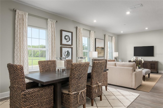 3744 Sky Mountain Aly, Apopka, FL 32712 - dining area with light hardwood / wood-style floors and a wealth of natural light