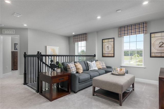 3744 Sky Mountain Aly, Apopka, FL 32712 - carpeted living room featuring a textured ceiling