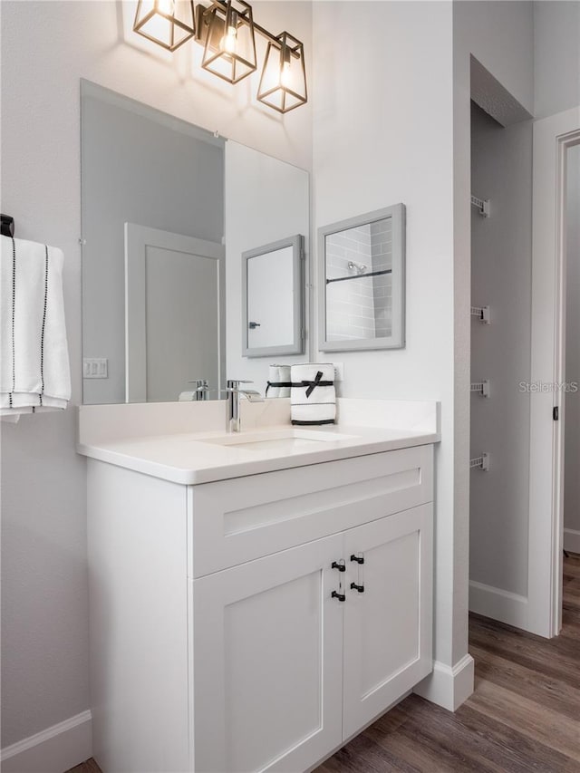 bathroom with vanity and hardwood / wood-style floors