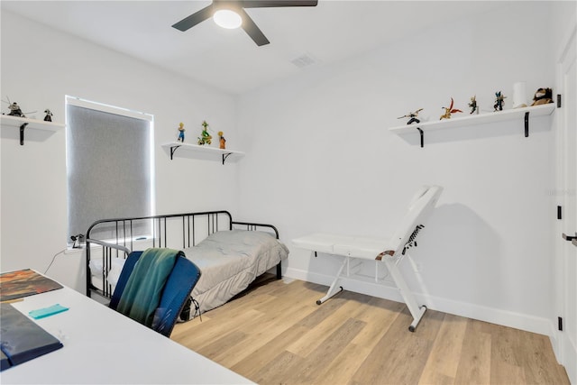 bedroom with hardwood / wood-style flooring and ceiling fan