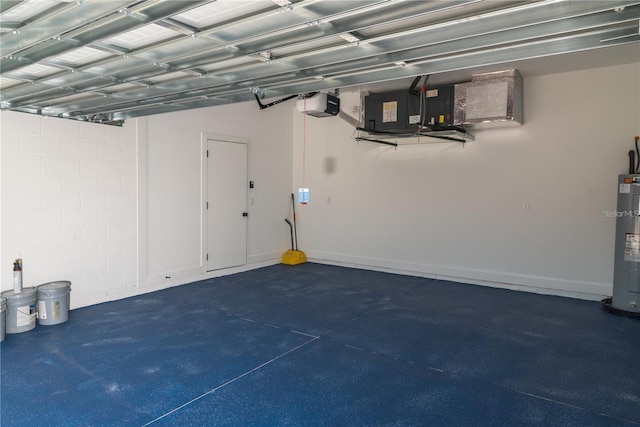 garage featuring a garage door opener and electric water heater