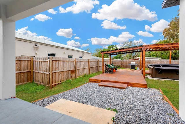 view of yard with a patio area, a hot tub, and a wooden deck