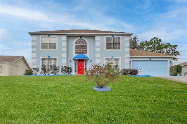 view of front of home with a garage and a front yard