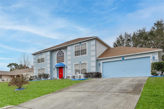 view of front of home featuring a front lawn and a garage