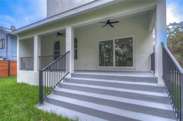 doorway to property featuring ceiling fan