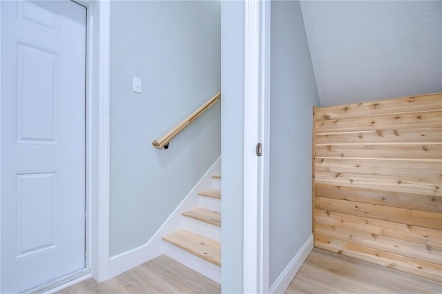 stairs featuring hardwood / wood-style flooring