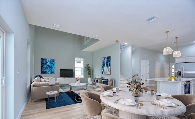 dining area with light hardwood / wood-style floors