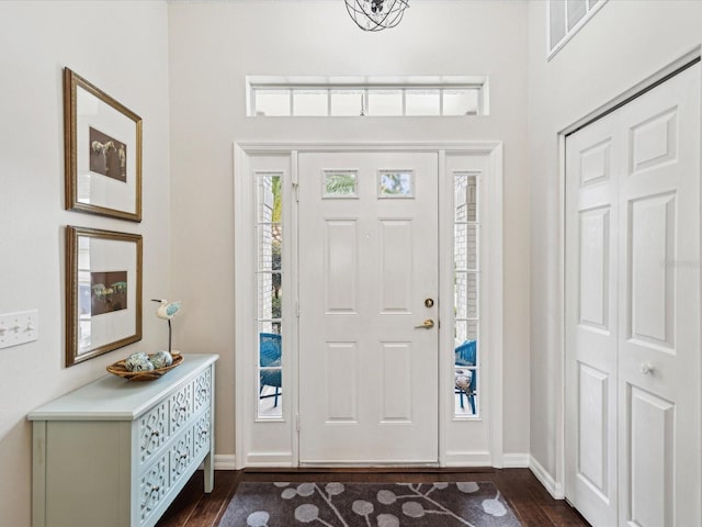 foyer entrance featuring dark hardwood / wood-style floors