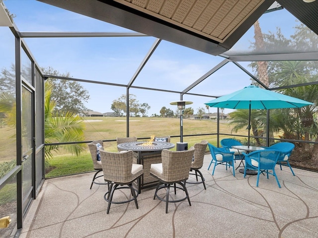 view of patio / terrace featuring glass enclosure