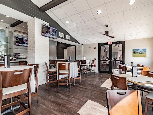 dining area with french doors, vaulted ceiling with beams, and dark hardwood / wood-style flooring