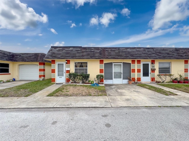 single story home with a garage