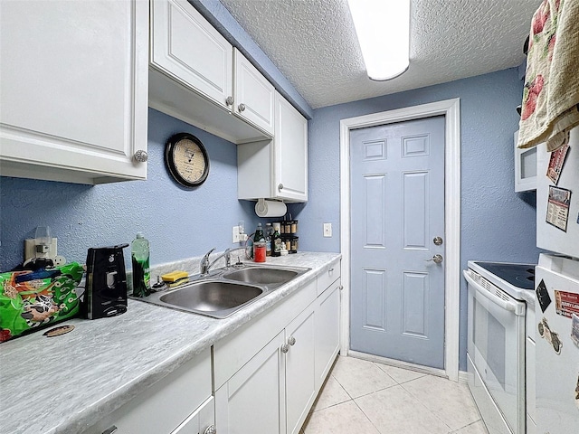 kitchen featuring electric stove, white cabinetry, sink, and light tile patterned flooring