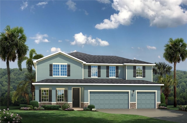 view of front of property with a front yard and a garage