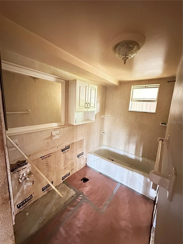 bathroom with a tub