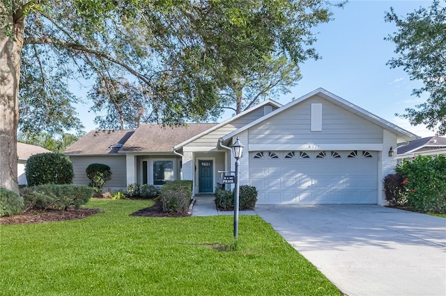 ranch-style house with a garage and a front yard