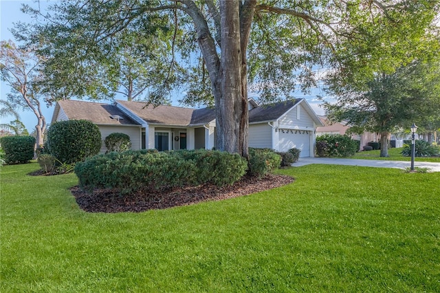 single story home featuring a front yard and a garage