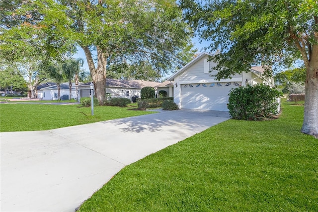 ranch-style house featuring a front lawn and a garage