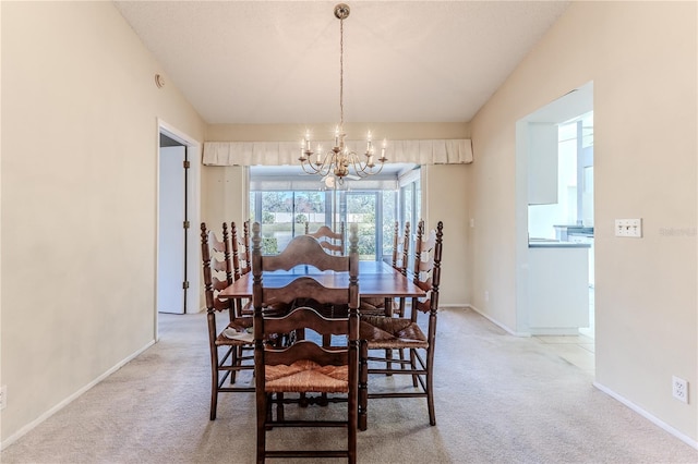 carpeted dining space featuring a notable chandelier