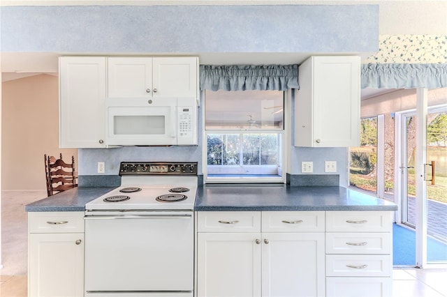 kitchen with white cabinets and white appliances