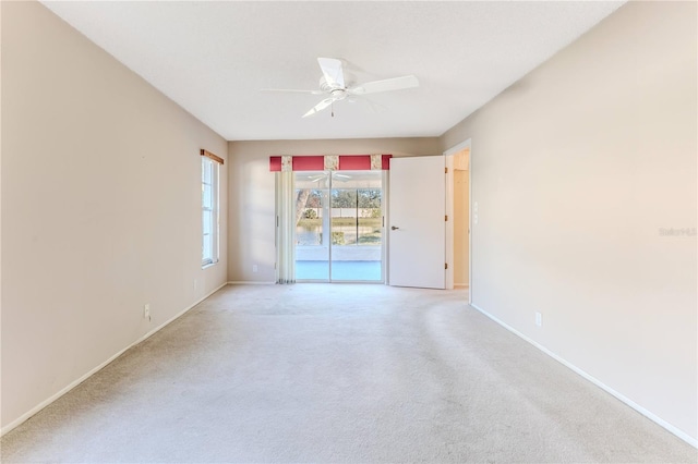 carpeted empty room with ceiling fan