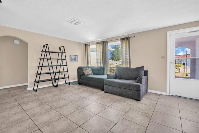 living room with light tile patterned floors