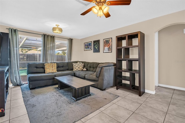 living room with ceiling fan and tile patterned floors