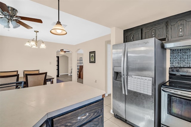 kitchen featuring wine cooler, appliances with stainless steel finishes, tasteful backsplash, light tile patterned flooring, and ceiling fan with notable chandelier