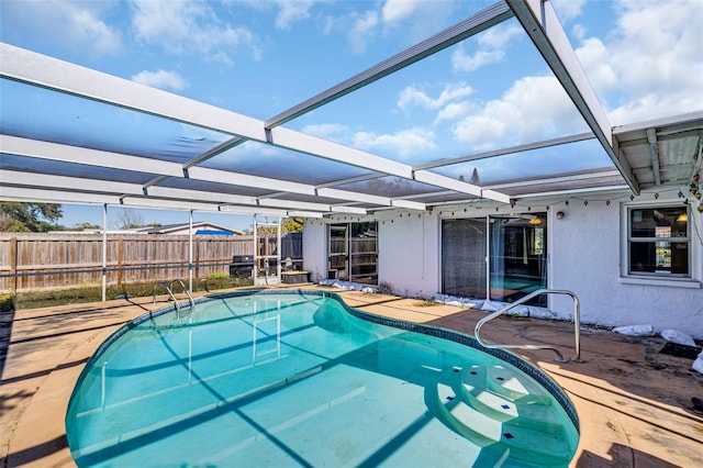 view of pool with a lanai and a patio area